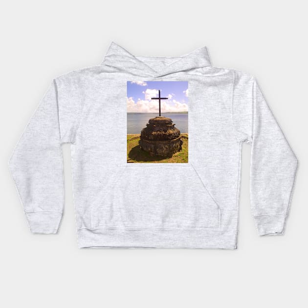 wooden cross on the riverbank Kids Hoodie by Marccelus